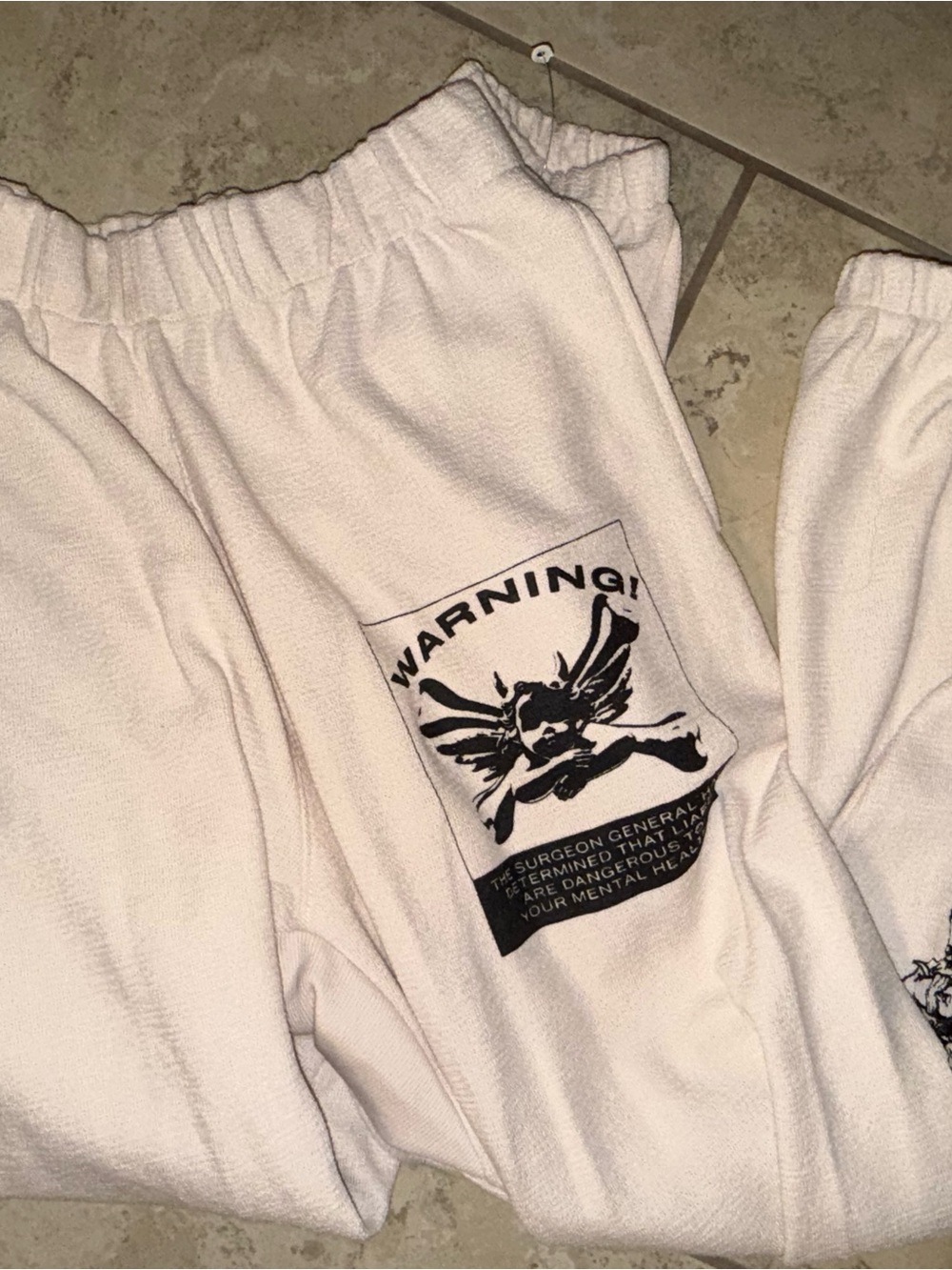 Boys Lie Cream Track Pants with Black Warning Graphic